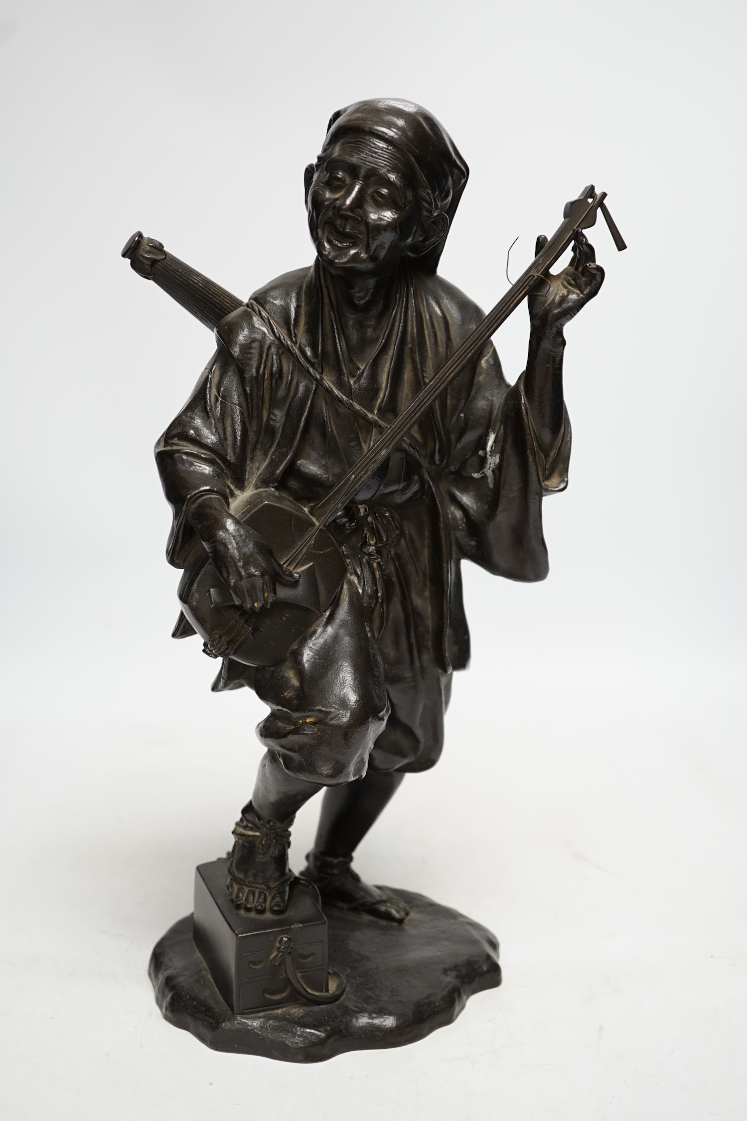 A Japanese bronze figure of a musician, Meiji period, 37cm high. Condition - good